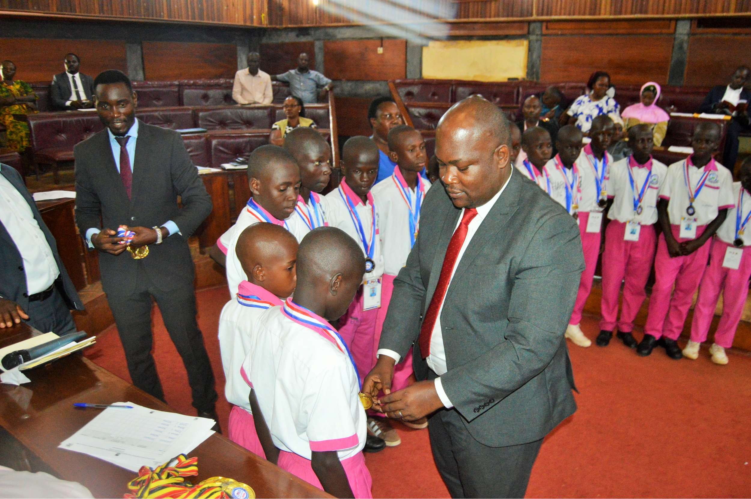 District Chairperson-Hon Kawuki Peter recognizes and celebrates excellence of Mpigi Pupils with Disabilities for winning the Trophy and Gold medals at the National Paralympic Games