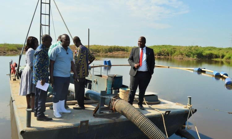 District Chairperson-Mr Kawuki Peter together with the NRM Chairperson-Mr Kaweesi Sulaiman visiting sand mines in Lwera