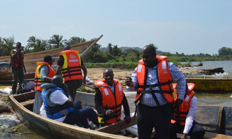 District Chairman -Hon. Kawuki Peter & Councilors together with CAO- Ms Edith Namayega boarding a boat to Buyiga island during a monitoring and supervision exercise